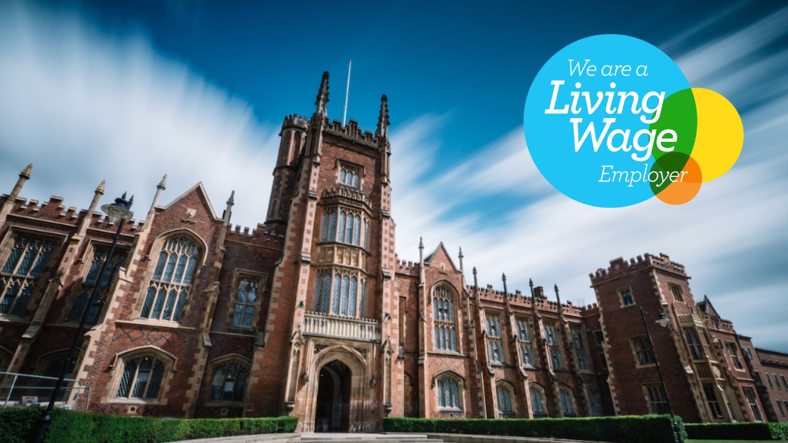 Front of Queen's Lanyon building with Real Living Wage Logo